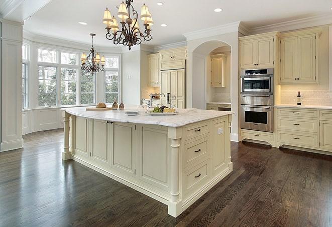 close-up of hand scraping laminate floors in Providence Forge